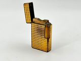 a lighter that is sitting on a white surface