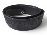 a close up of a black belt on a white background