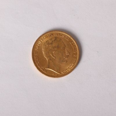 a gold coin with a picture of a woman on it