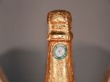 two bottles of champagne with a clock on the top