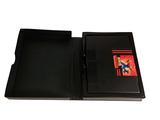 a black folder with a card and a pen in it