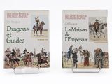 pair of books on display on a white surface with a white background