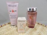 two bottles of kerastase and a box of lotion on the table