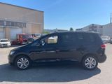 the black van is parked in a parking lot near a building