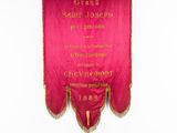 a red and gold banner hanging on a wall