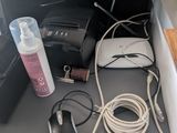 a desk with a computer, a mouse, and other items on it