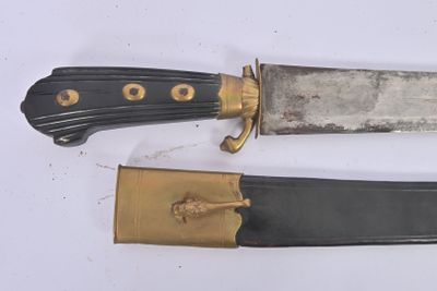 two knives that are laying side by side on a table