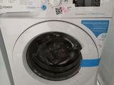 a washing machine and a dryer sitting on a pallet
