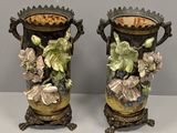 pair of antique vases with flowers and leaves painted on them