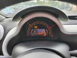a car dashboard with a speedometer and a steering wheel