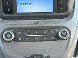 a picture of a car dashboard with a clock on it