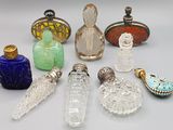 a lot of glass bottles that are sitting on a table
