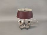 a lamp that is sitting on a table with a red shade