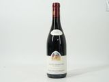 a bottle of wine that is sitting on a table