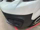 a close up of a car with a red light on the front of it