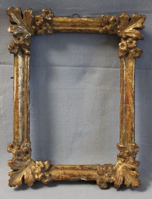 an old gold frame with a decorative design on it