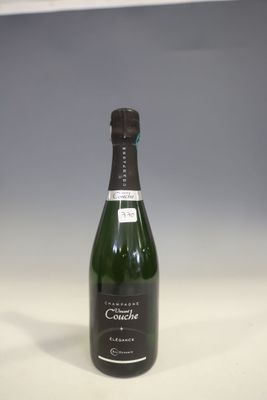 a bottle of champagne sitting on a table