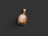 a gold pendant with an image of a woman in a shell