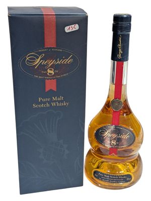 an image of a bottle of whisky next to a box