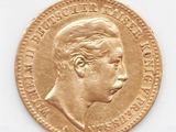 une vieille pièce d'or sur laquelle figure le portrait d'un homme
