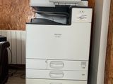 a white printer sitting on top of a black and white printer