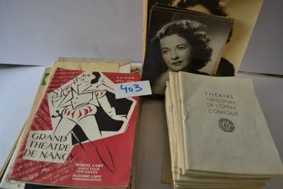several books are stacked on top of each other on a table