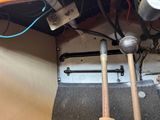 two baseball bats that are sitting on the floor
