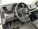 the interior of a car with a steering wheel and dashboard controls