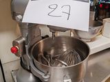 a mixer on the counter with a price tag on it