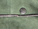 a close up of a piece of cloth with a button on it