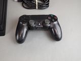 a video game controller sitting on a table next to a keyboard
