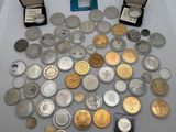 many different types of coins on the table