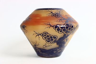 a vase that has a picture of a tree on it