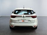 the rear end of a white car in a white room