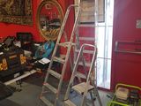 a ladder that is leaning against a wall in a room