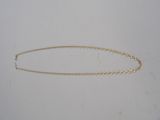 the gold chain is attached to the back of the necklace