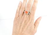 an image of a woman ' s hand with a ring on it ' s finger
