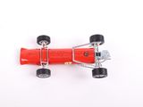 an overhead view of a red toy race car on a white surface