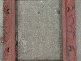 a picture of a picture frame sitting on the ground