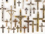 many different types of crucifs displayed on the wall