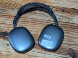 a pair of headphones sitting on a wooden table