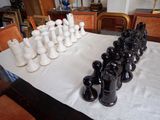 a lot of black and white vases on a table