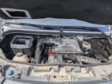 a car engine with its hood open and the hood open