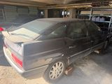 a black car that is parked in a garage