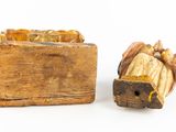 a small wooden box with a figurine of a manger and a wooden box with a manger