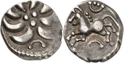 a close up of a coin with a horse on it
