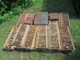 a pile of old wooden pallets on the ground