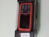 un téléphone portable rouge et noir dans une boîte