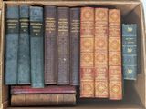 a box full of old books sitting on a table
