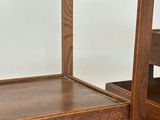 a small wooden box with a handle on top of it